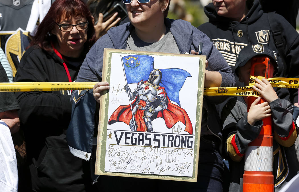 A Golden Knights fan holds up a sign outside City National Arena during a send-off event ahead of games three and four of the NHL playoff series against Los Angeles Kings on Saturday, April 14, 20 ...