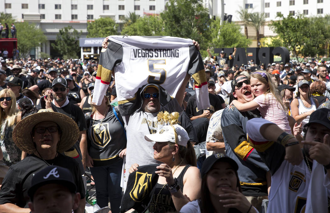 A Golden Knights fan holds up a jersey after the Knights defeated the Winnipeg Jets 2-1 during a watch party for Game 5 of the Western Conference Finals at Toshiba Plaza in Las Vegas on Sunday, Ma ...