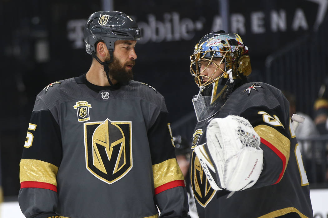 Golden Knights goaltender Marc-Andre Fleury (29) talks with Golden Knights defenseman Deryk Engelland (5) during a break during the second period of Game 2 of an NHL hockey second-round playoff se ...