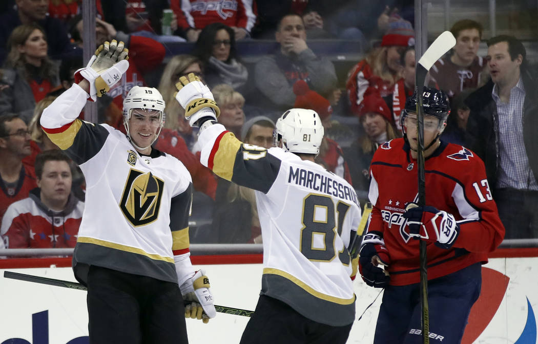 Vegas Golden Knights right wing Reilly Smith, left, and center Jonathan Marchessault celebrate Smith's goal with Washington Capitals left wing Jakub Vrana (13), from the Czech Republic, nearby in ...
