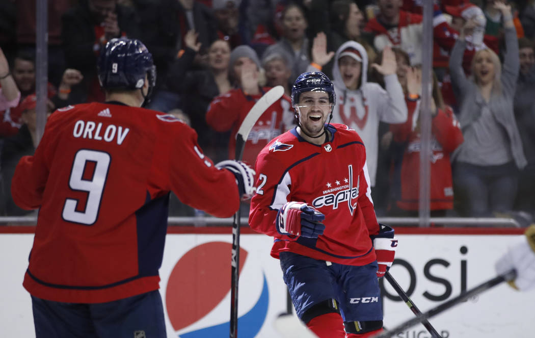 Washington Capitals defenseman Matt Niskanen, right, celebrates his goal with defenseman Dmitry Orlov (9), from Russia, in the second period of an NHL hockey game against the Vegas Golden Knights, ...