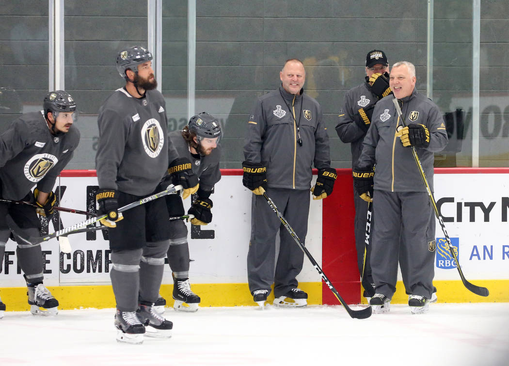 Golden Knights head coach Gerard Gallant, left, and first assistant coach Mike Kelly watch their players during team practice at City Center Arena on Wednesday, May 23, 2018, in Las Vegas. Bizuaye ...