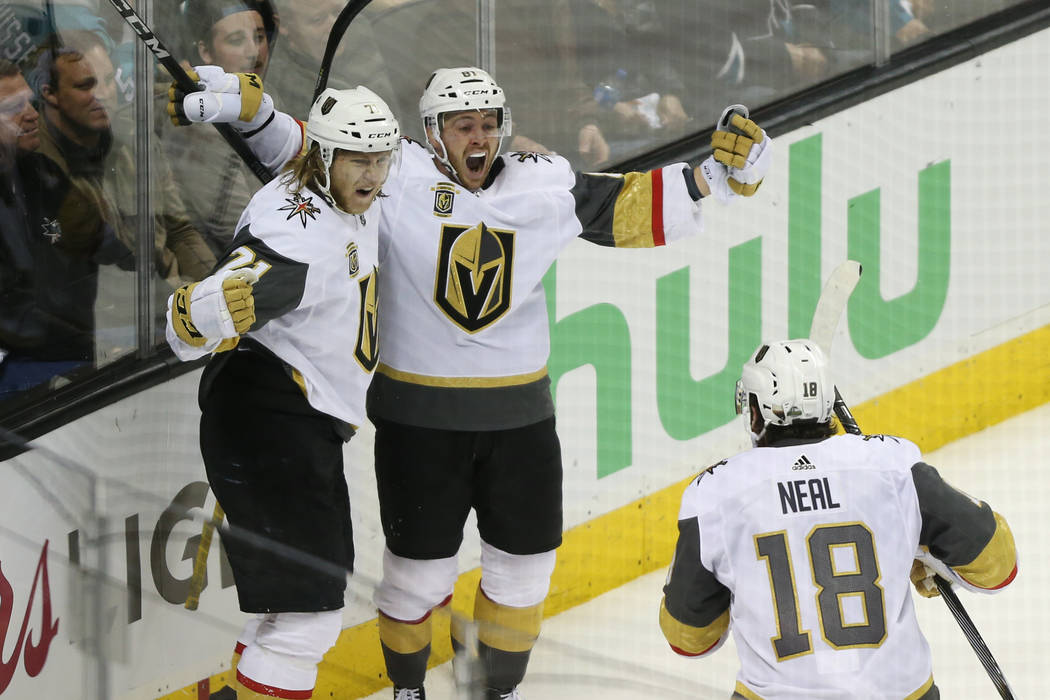 Vegas Golden Knights center William Karlsson (71) celebrates his score with center Jonathan Marchessault (81) and left wing James Neal (18) during overtime in Game 3 of an NHL hockey second-round ...
