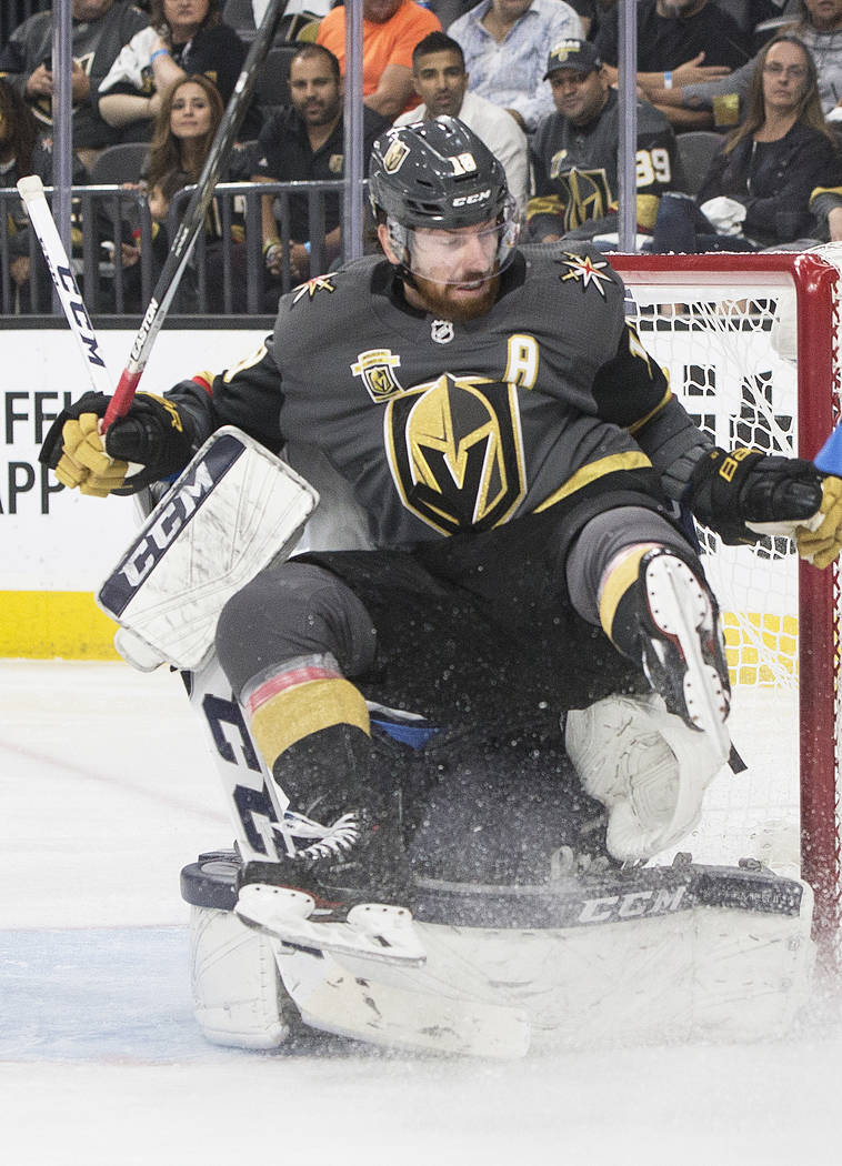 Golden Knights left wing James Neal (18) collides with Jets goaltender Connor Hellebuyck (37) in the third period during game four of Winnipeg's NHL Western Conference Finals matchup with the Gold ...