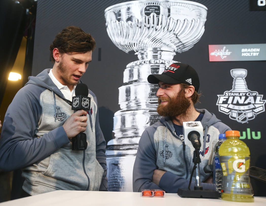 Washington Capitals left wing Andre Burakovsky, left, interviews goaltender Braden Holtby during NHL hockey media day for the Stanley Cup Final at the T-Mobile Arena in Las Vegas on Sunday, May 27 ...