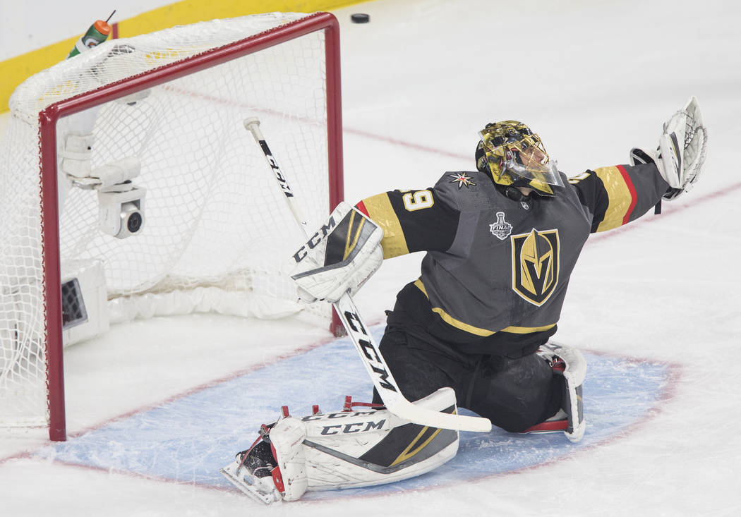Golden Knights goaltender Marc-Andre Fleury (29) makes a save in the first period during Vegas' Game 1 matchup with the Washington Capitals during the NHL Stanley Cup Finals on Monday, May 28, 201 ...