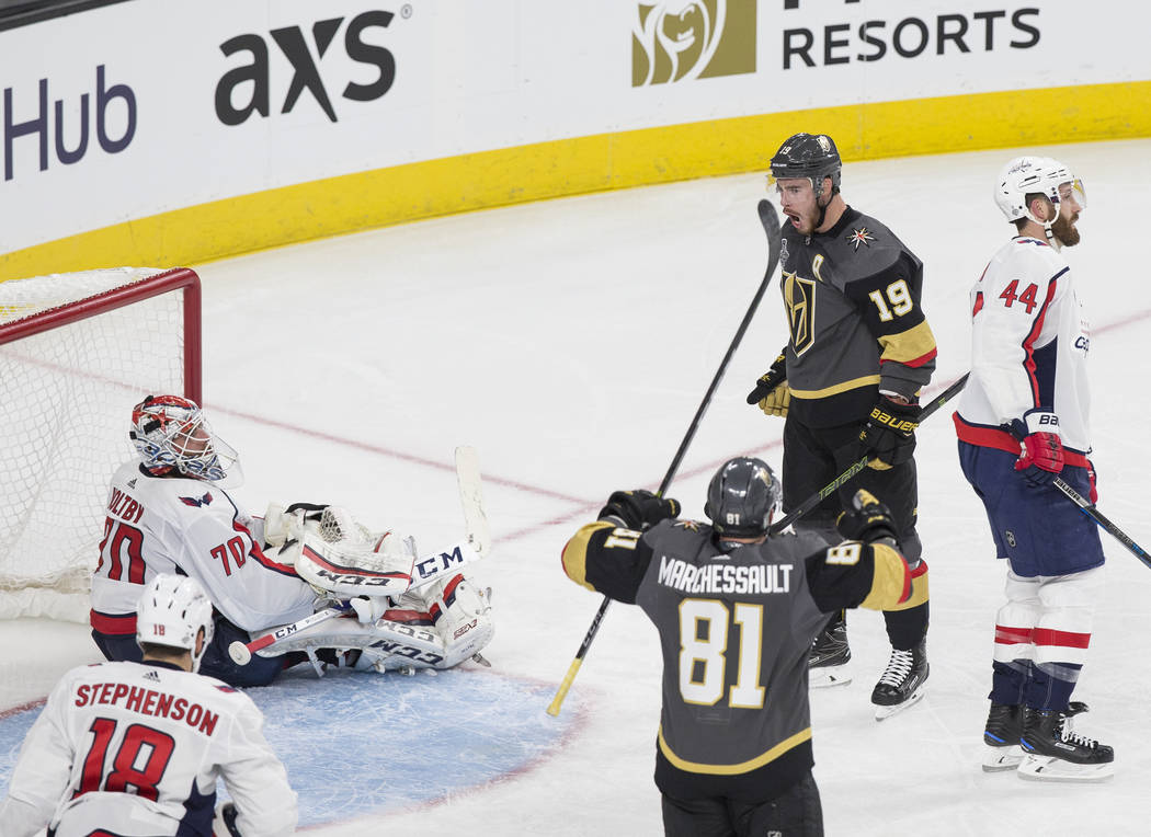Golden Knights right wing Reilly Smith (19) celebrates with center Jonathan Marchessault (81) after scoring a second-period goal against Capitals goaltender Braden Holtby (70) during Game 1 of the ...