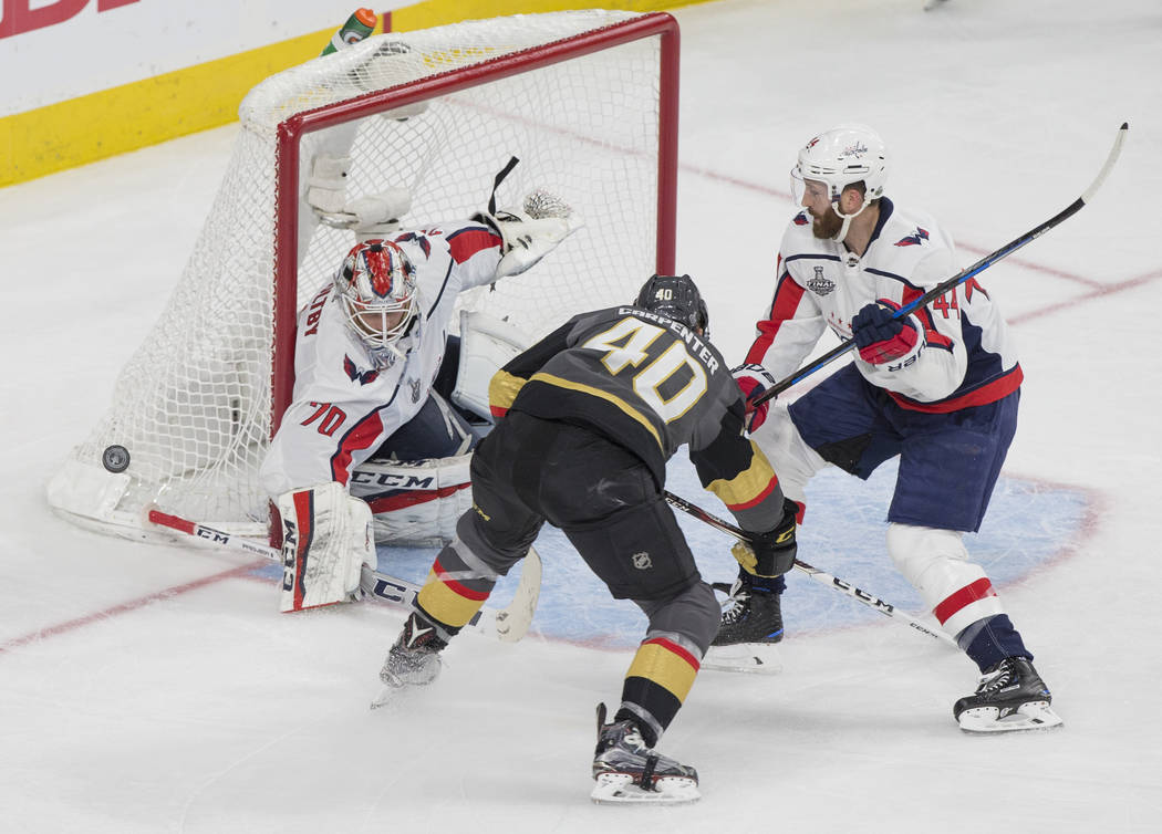 Capitals goaltender Braden Holtby (70) makes a second-period save against Golden Knights center Ryan Carpenter (40) during Game 1 of the NHL Stanley Cup Finals on Monday, May 28, 2018, at T-Mobile ...
