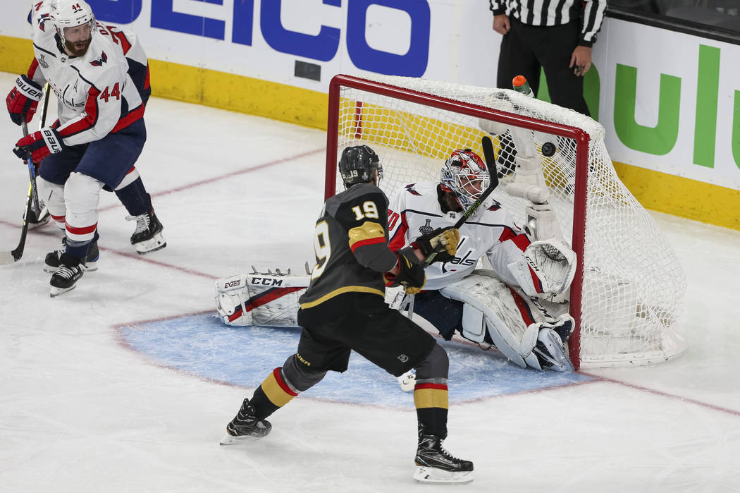 Vegas Golden Knights right wing Reilly Smith (19) scores against Washington Capitals goaltender Braden Holtby (70) during the second period in Game 1 of the NHL hockey Stanley Cup Finals between t ...