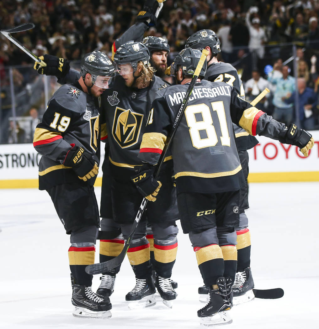 Golden Knights players celebrate a goal by Golden Knights center William Karlsson, second from left, against the Washington Capitals during the first period of Game 1 of the NHL hockey Stanley Cup ...