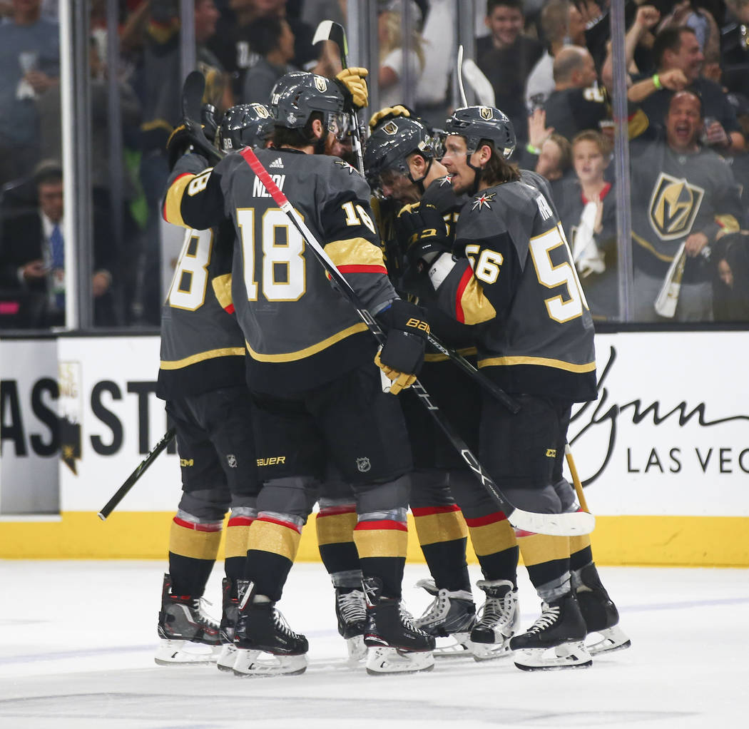 Golden Knights players celebrate a goal by Golden Knights defenseman Colin Miller against the Washington Capitals during the first period of Game 1 of the NHL hockey Stanley Cup Final at the T-Mob ...