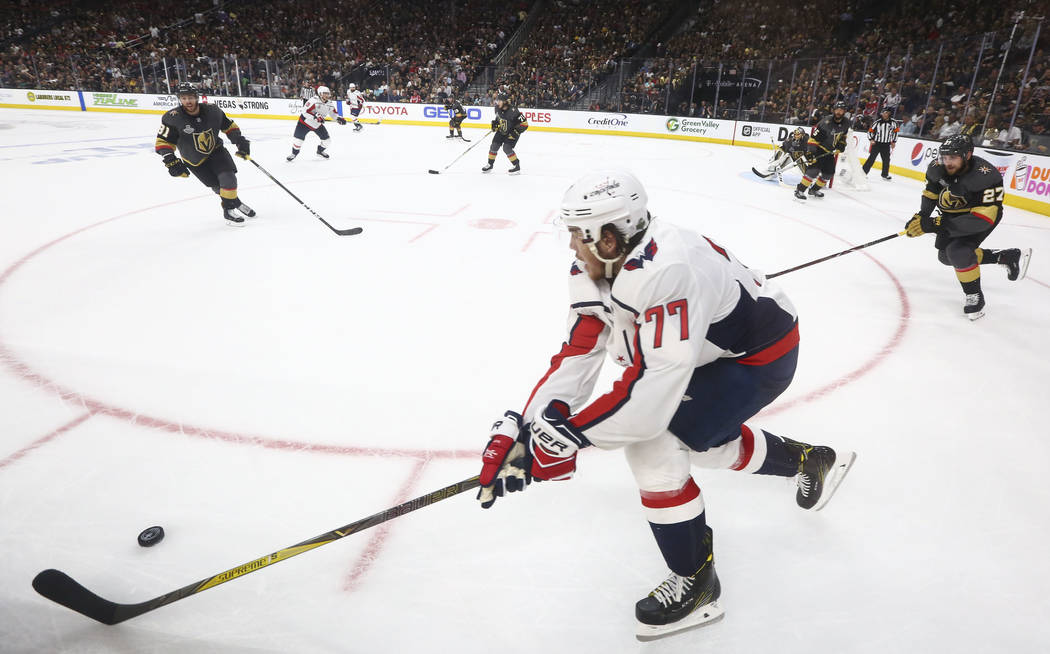 Washington Capitals right wing T.J. Oshie (77) moves the puck against the Golden Knights during the second period of Game 1 of the NHL hockey Stanley Cup Final at the T-Mobile Arena in Las Vegas o ...