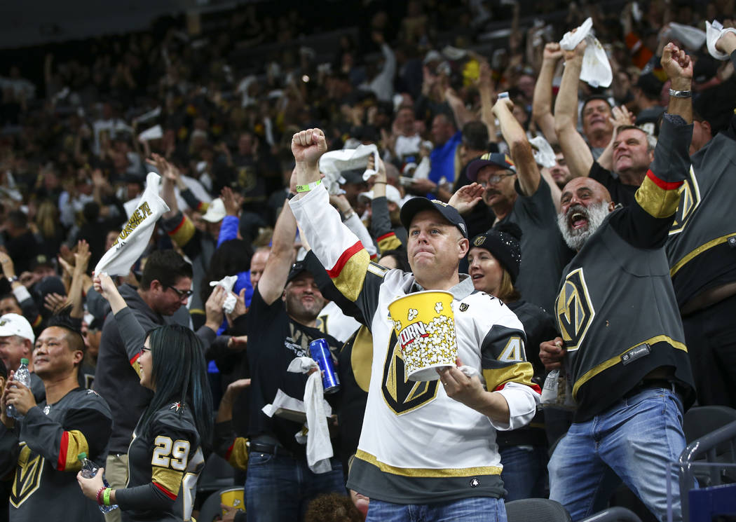 Golden Knights fans celebrate a goal by Golden Knights right wing Reilly Smith, not pictured, during the second period of Game 1 of the NHL hockey Stanley Cup Final against the Washington Capitals ...