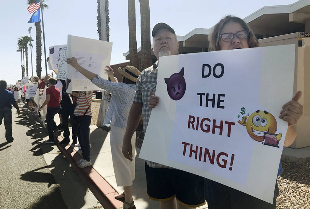 Educators rally outside the Edward Greer Education Center in Las Vegas to fight for pay raises on Saturday, April 28, just before community meetings for the six Clark County School District superi ...