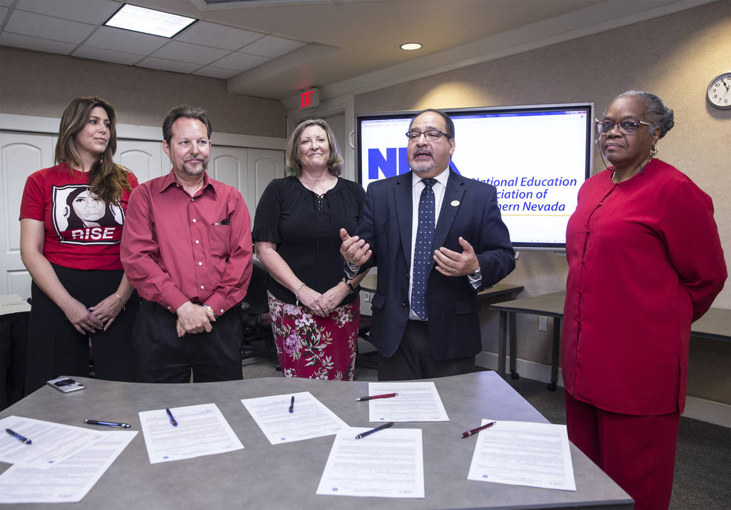 Mercedes Krause, left, Chet Miller, Carmen Andrews, Ruben Murillo and Patricia Stevens officially announce a new teachers union for Clark County educators called the National Education Association ...
