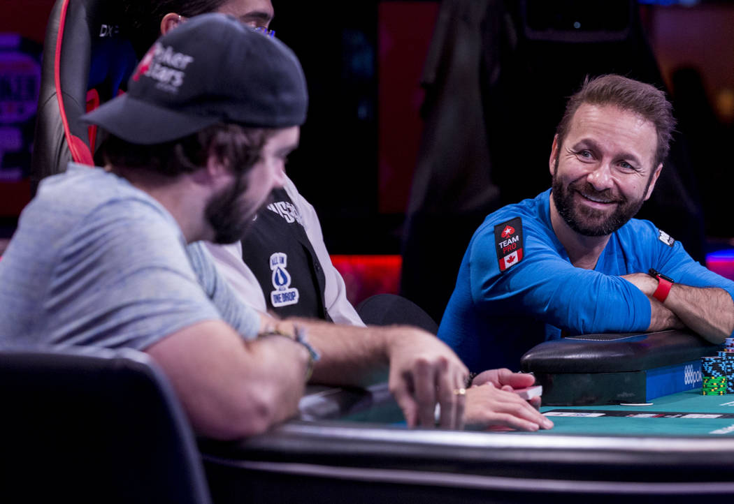 Daniel Negreanu, right, looks at his opponent Jason Mercier across the table during the World Series of Poker $10,000 no-limit hold 'em Main Event at the Rio Convention Center in Las Vegas, Monda ...