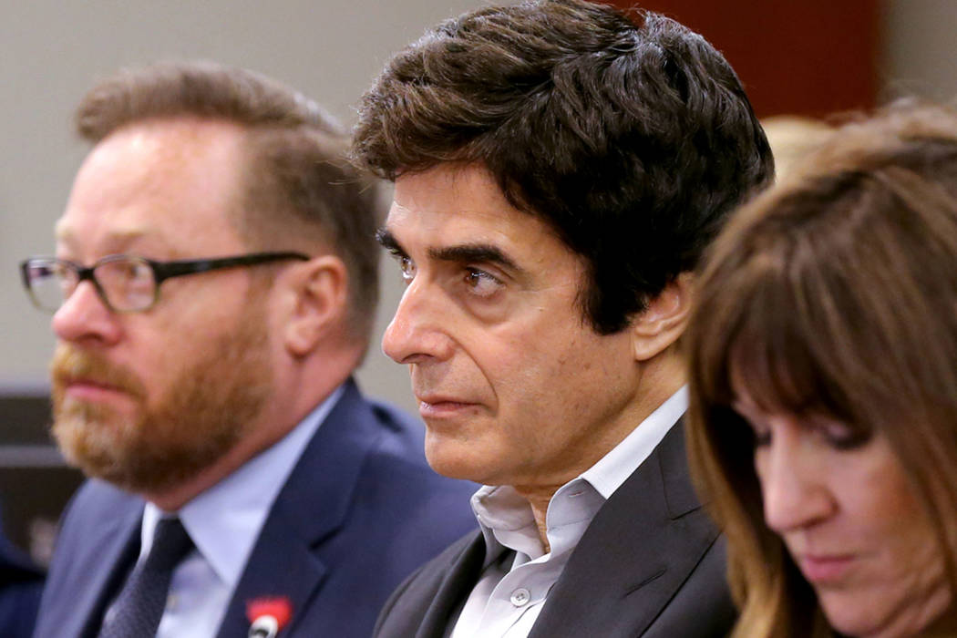 David Copperfield, center, listens to closing arguments during a civil trial at the Regional Justice Center in Las Vegas on Friday, May 25, 2018. With Copperfield are, from left, Chris Kenner, pre ...
