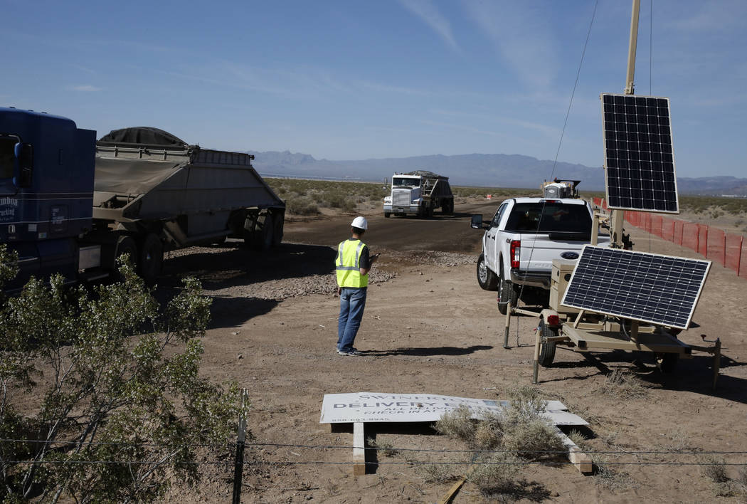 A worker directs traffic at the construction site of the El Dorado Valley solar projects on Thursday, May 31, 2018, in Boulder City. Bizuayehu Tesfaye/Las Vegas Review-Journal @bizutesfaye