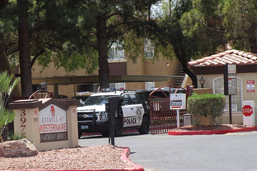 A police vehicle leaves the Estates at Westernaire Apartment Homes at 3975 N. Nellis Blvd. on Thursday after investigators responded to a report of a 2-year-old gunshot victim. (Greg Haas/Las Vega ...