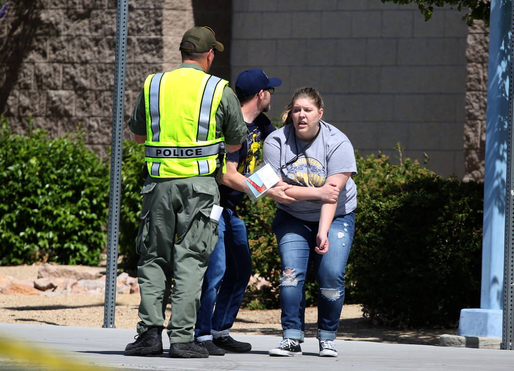 A Las Vegas police officer conducts a mass shooting drill with students, coordinated by the Metropolitan Police Department and the various agencies in the area, at Shadow Ridge High School on Wedn ...