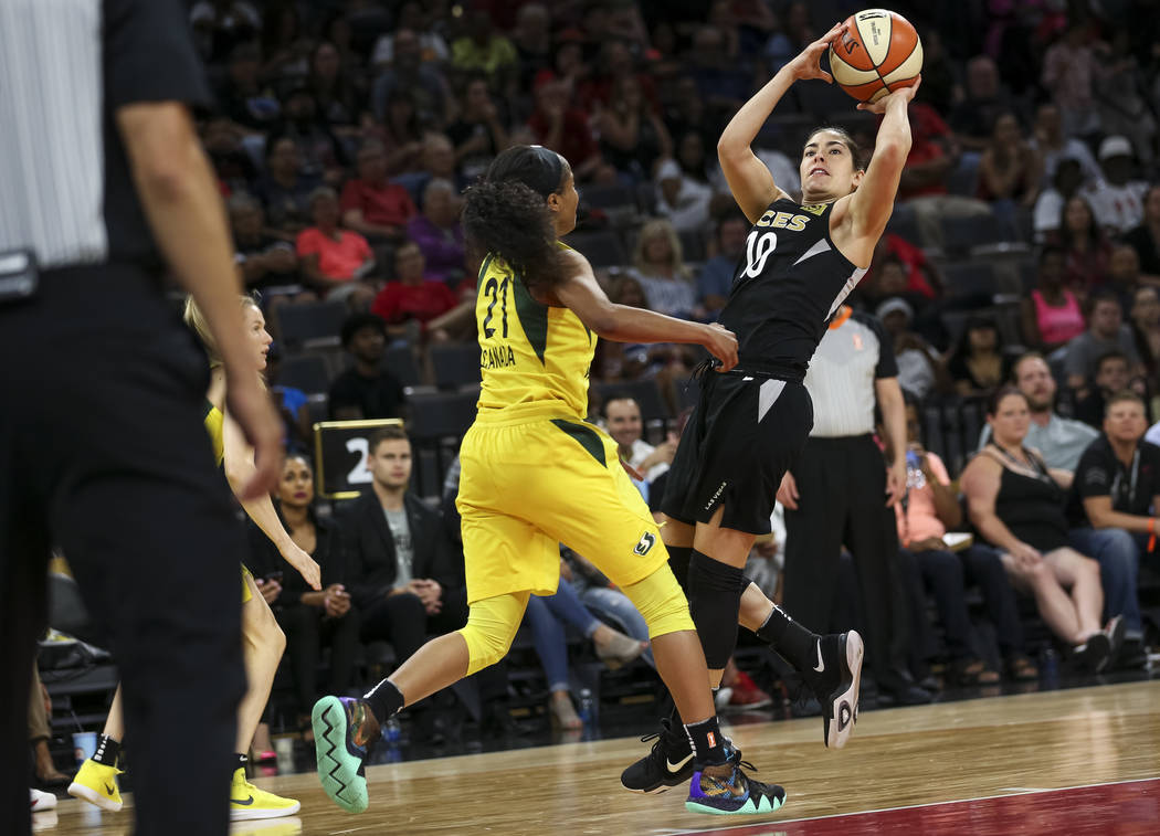 Las Vegas Aces guard Kelsey Plum (10) shoots over Seattle Storm guard Jordin Canada (21) in the second half of a WNBA basketball game at the Mandalay Bay Events Center in Las Vegas on Sunday, May ...