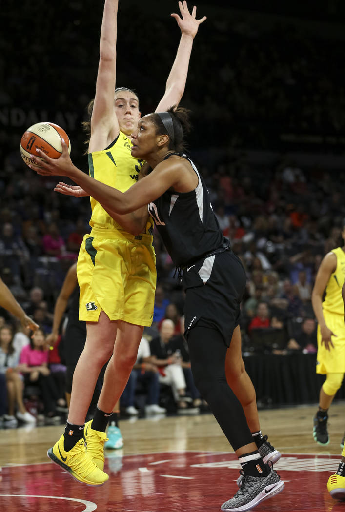 Las Vegas Aces center A'ja Wilson (22) goes up for a shot against Seattle Storm forward Breanna Stewart (30) in the second half of a WNBA basketball game at the Mandalay Bay Events Center in Las V ...