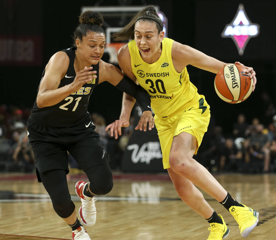 Seattle Storm forward Breanna Stewart (30) drives the ball against Las Vegas Aces guard Kayla McBride (21) in the first half of a WNBA basketball game at the Mandalay Bay Events Center in Las Vega ...
