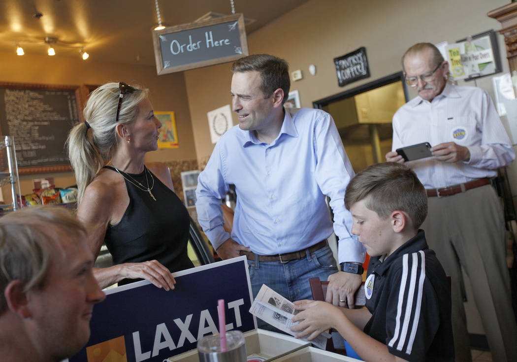 Cynthia Ross speaks to her cousin Adam Laxalt, a Republican running for Governor, next to her son Jansen Ross, 11, at a "Get-Out-The-Vote" campaign at Avery's Coffee Shop in Las Vegas, W ...