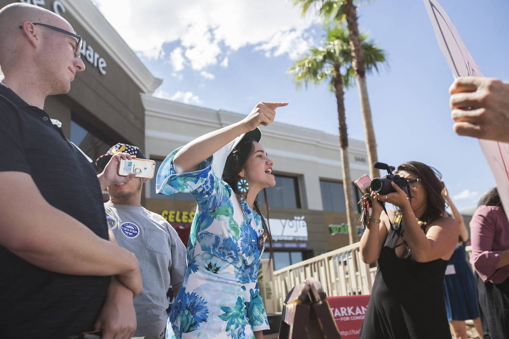 Celeste McWhorter yells at protestors at a "Get-Out-The-Vote" campaign at Avery's Coffee Shop in Las Vegas, Wednesday, May 30, 2018. Adam Laxalt, a Republican running for Governor, and D ...