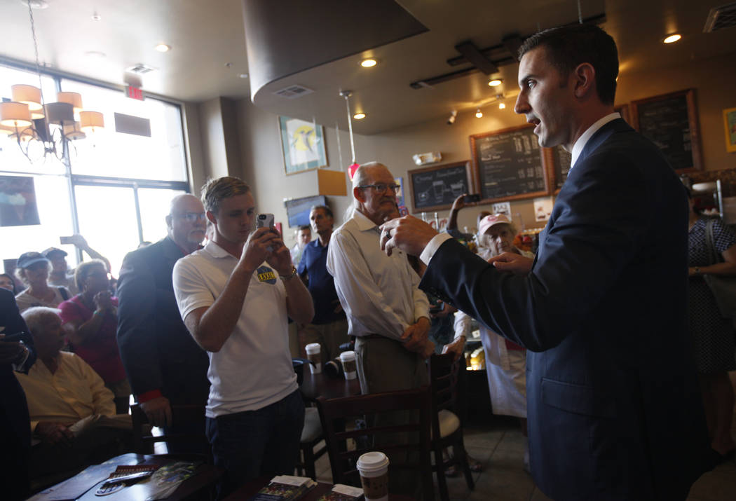 Wes Duncan, a Republican running for Attorney General, speaks to the crowd at a "Get-Out-The-Vote" campaign at Avery's Coffee Shop in Las Vegas, Wednesday, May 30, 2018. Adam Laxalt, a R ...