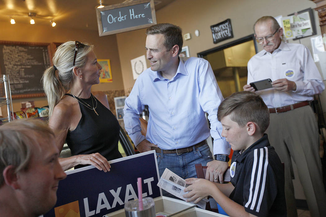 Cynthia Ross speaks to her cousin Adam Laxalt, a Republican running for Governor, next to her son Jansen Ross, 11, at a "Get-Out-The-Vote" campaign at Avery's Coffee Shop in Las Vegas, W ...