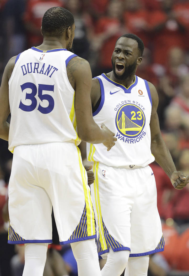 Golden State Warriors Forward Draymond Green 23 Celebrates A Play With Teammate Kevin Durant 35 During The First Half In Game 7 Of The Nba Basketball Western Conference Finals Against The Hous