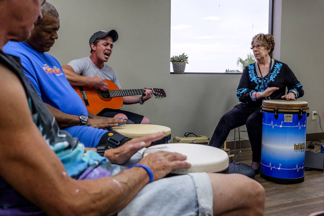 Music therapist Judith Pinkerton works with recovering addicts, including singer and guitarist Shawn Wallen at the Resolutions Recovery center in Las Vegas on Tuesday, April 26, 2018. Patrick Con ...