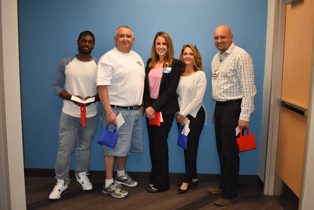 Southern Hills Hospital employees Andrew Brown, left, Brian Abeyta, Alexis Mussi, Kathleen Milhiser and Michael Sanders will be recognized for their efforts during a domestic violence case at this ...