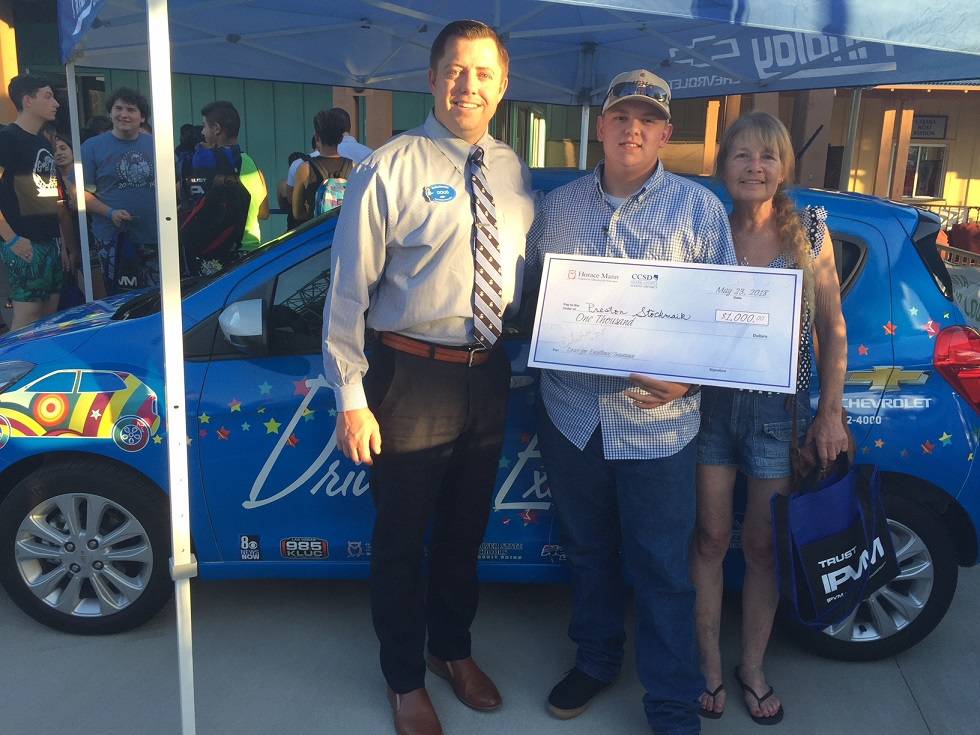 Findlay Findlay Chevrolet General Manager Doug Fleming, left, congratulates CimarronMemorial