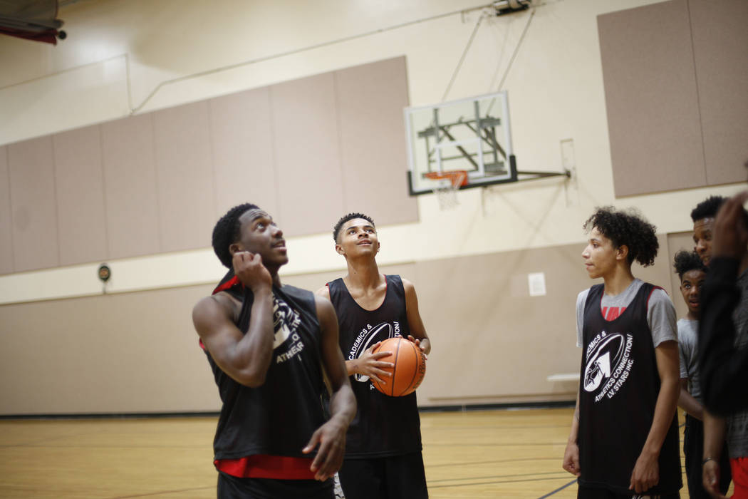 Khalid King, 16, from left, D'Andre Burnett, and Jordan McGriff, 17, wait for their turn during basketball practice for the LV Stars at the Chuck Minker Sports Complex in Las Vegas, Tuesday, May 8 ...