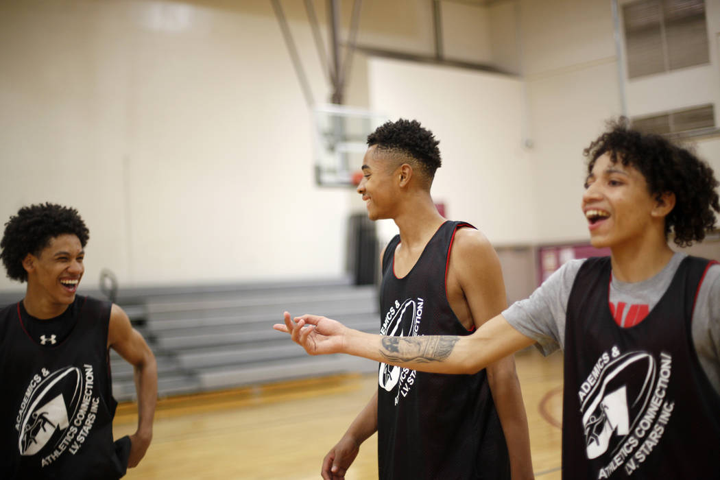 Jordan Carter, 18, from left, D'Andre Burnett, and Jordan McGriff laugh during basketball practice for the LV Stars at the Chuck Minker Sports Complex in Las Vegas, Tuesday, May 8, 2018. Rachel As ...