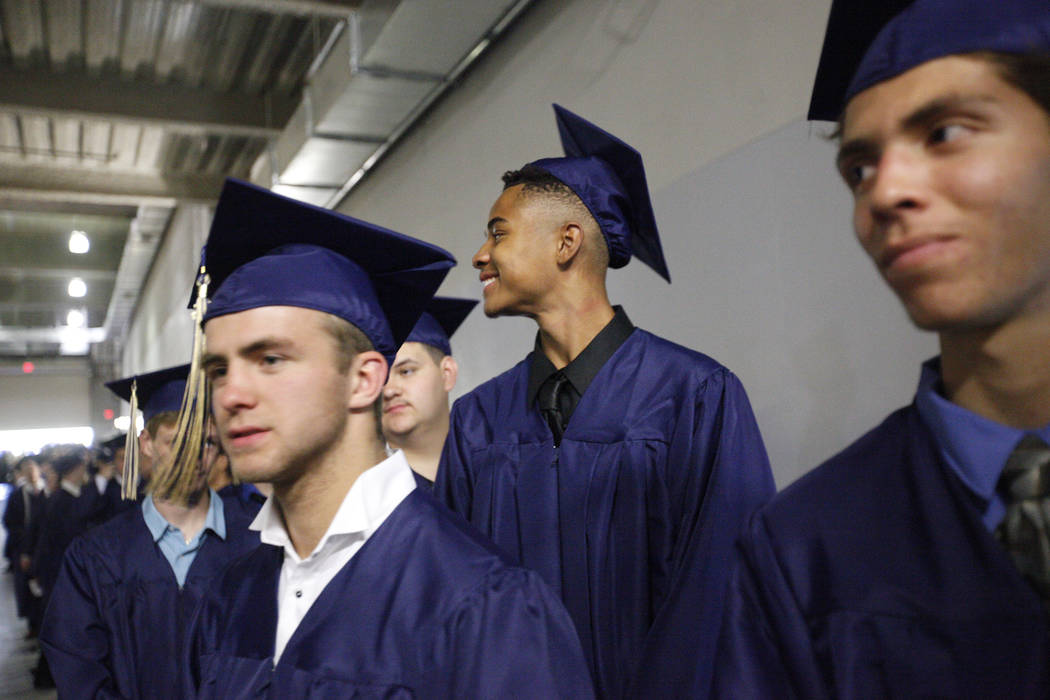 D'Andre Burnett waits in line on graduation day at the Thomas & Mack Center in Las Vegas, Thursday, May 24, 2018. Burnett finished his credits the day before in order to make the deadline of g ...