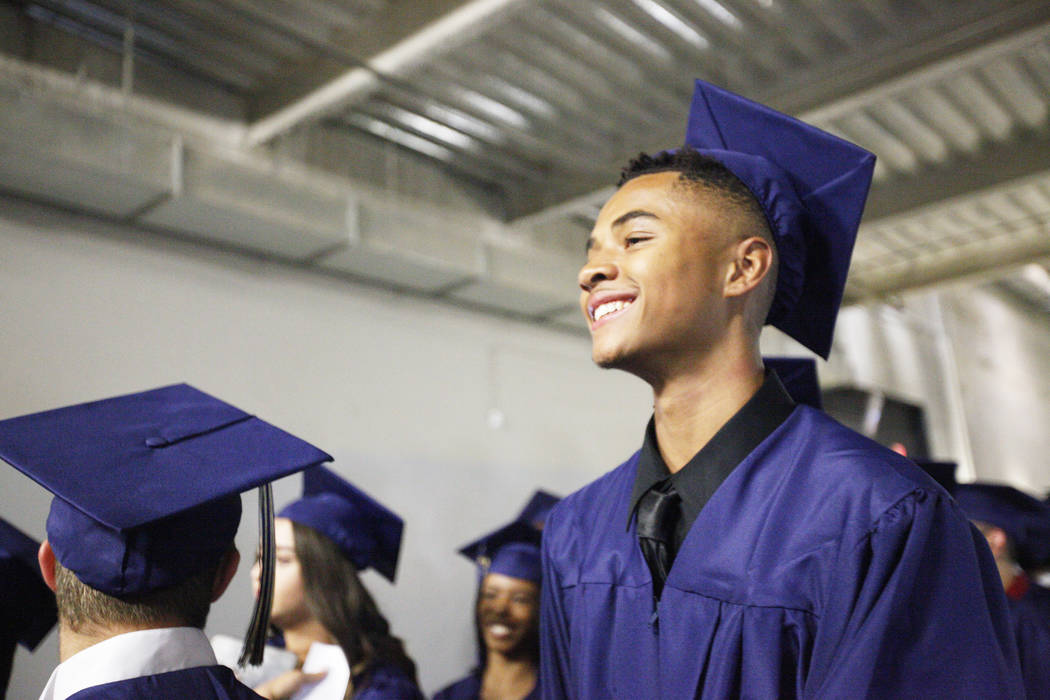 D'Andre Burnett waits in line on graduation day at the Thomas & Mack Center in Las Vegas, Thursday, May 24, 2018. Burnett finished his credits the day before in order to make the deadline of g ...
