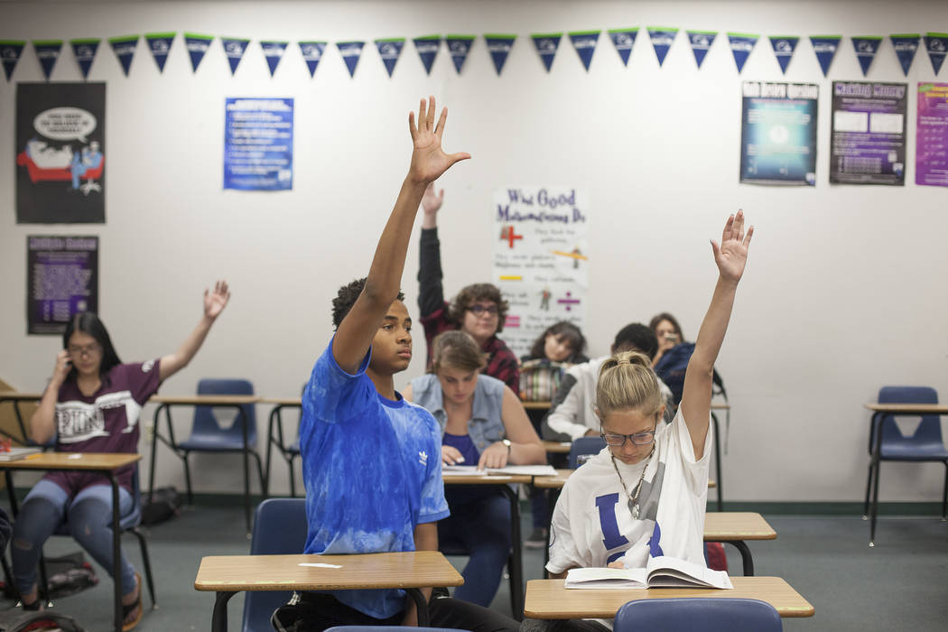 D'Andre Burnett, left, raises his hand to answer a quesion next to Marykate Springer in math class at Shadow Ridge High School in Las Vegas, Wednesday, May 16, 2018. Rachel Aston Las Vegas Review- ...