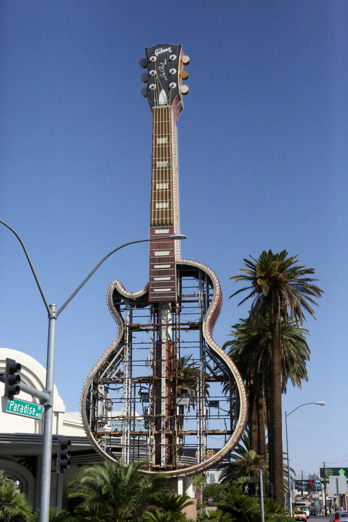 The Hard Rock Café neon sign at the corner of Harmon and Paradise is coming down and moving to its new home in the Neon Museum. Friday, September 1, 2017 Michael Quine Las Vegas Review-Journa ...