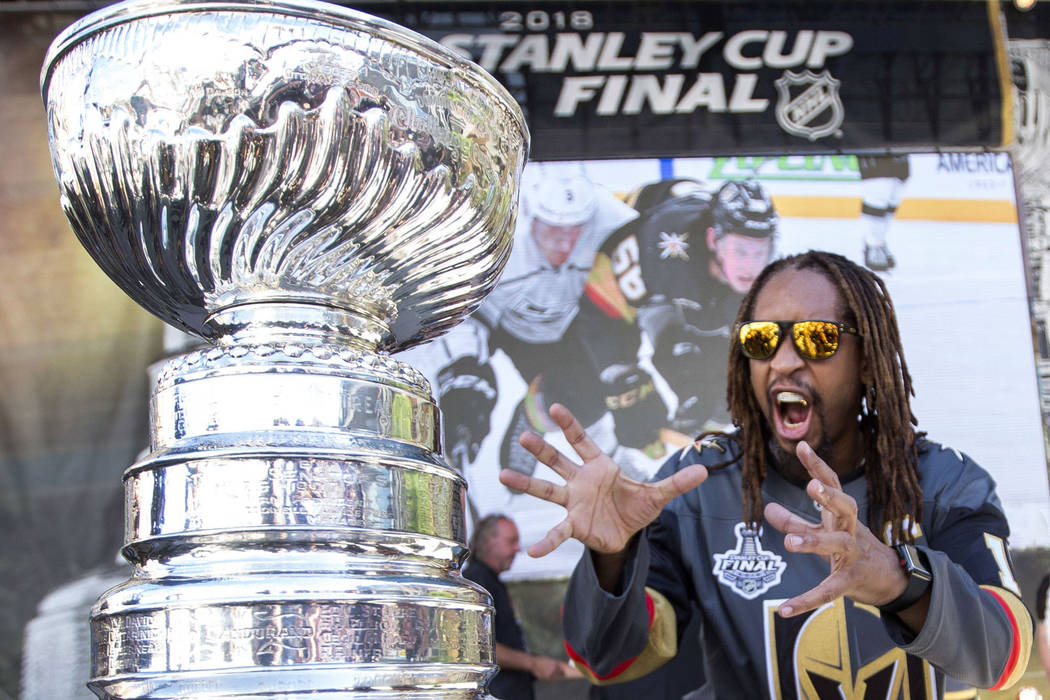 American rapper Lil Jon poses with the Stanley Cup before Game 1 of the NHL hockey Stanley Cup Finals between the Vegas Golden Knights and the Washington Capitals outside T-Mobile Arena in Las Veg ...