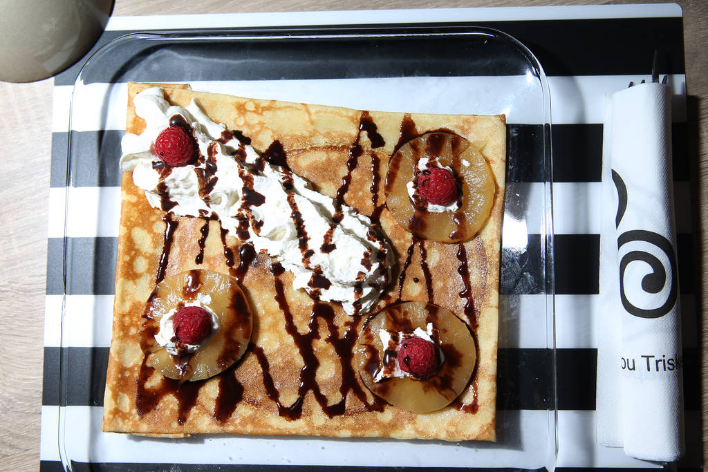 A crepe served with cooked pineapples, salted caramel, raspberries, and whipped cream, at The Real Crepe, 7595 W. Washington Ave., in Las Vegas, Tuesday, June 5, 2018. Erik Verduzco Las Vegas Revi ...