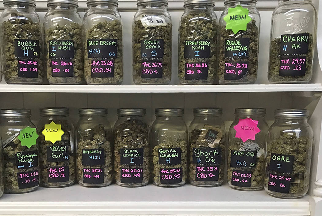 Different strains of marijuana are displayed in West Salem Cannabis, a marijuana shop in Salem, Ore. (AP Photo/Andrew Selsky, File)