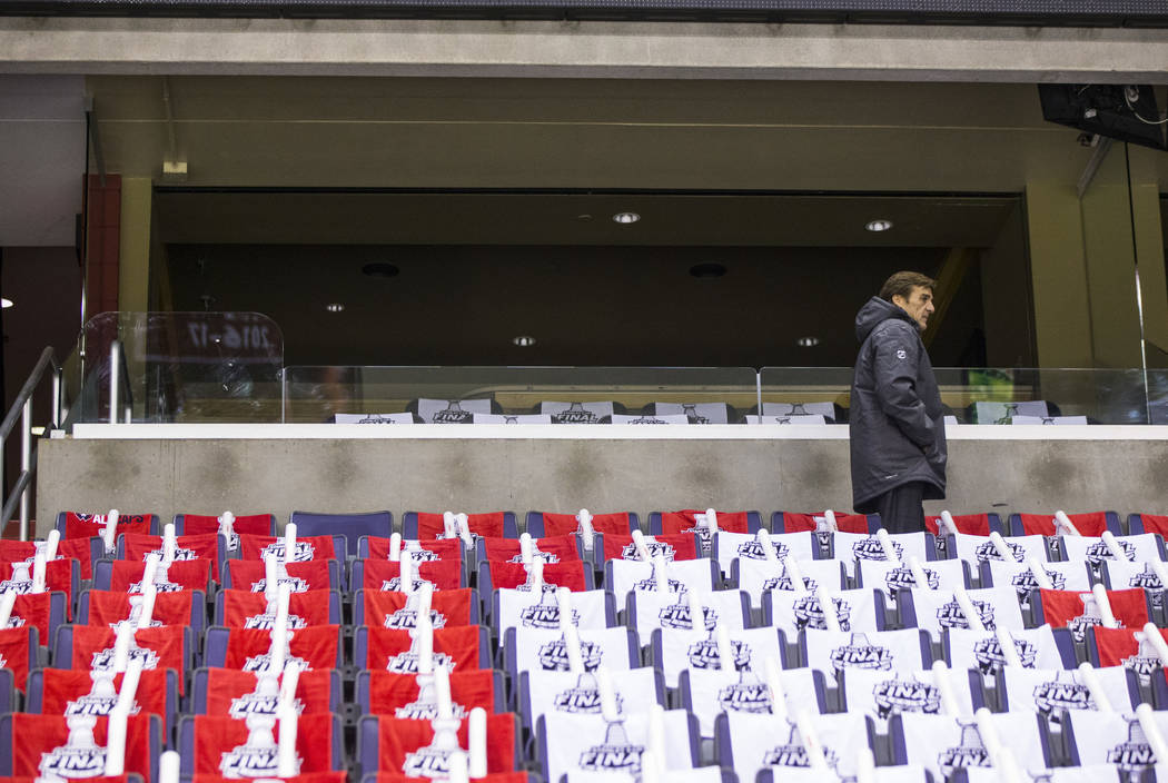 George McPhee, general manager of the Golden Knights, fins a spot to watch practice ahead of Game 3 of the Stanley Cup Final against the Washington Capitals at Capital One Arena in Washington on S ...