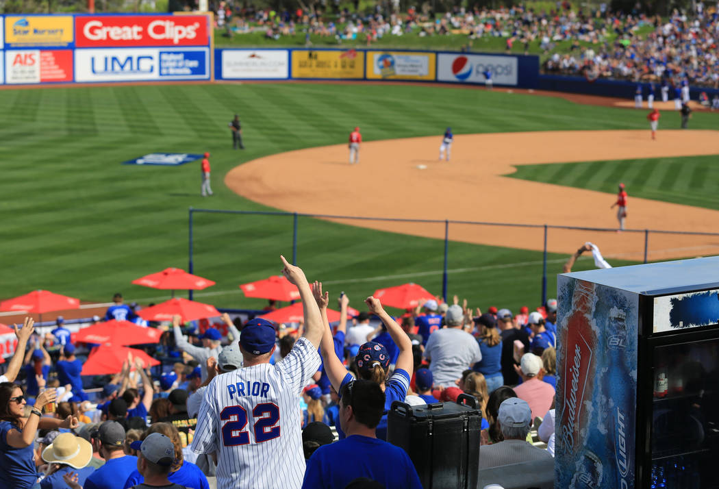 Cubs fans cheer for a home run by Alber Almora Jr. (5) watch a game between the Chicago Cubs and the Cincinnati Reds at Cashman Field in Las Vegas on Sunday, March 26, 2017. (Brett Le Blanc/Las Ve ...