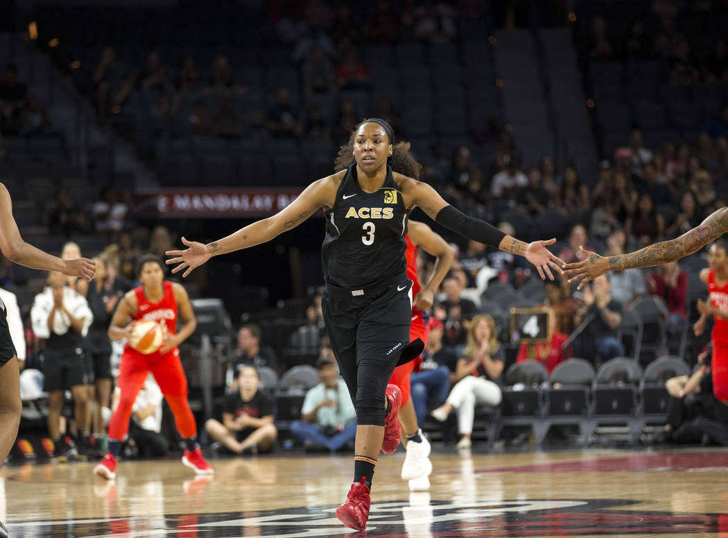 Las Vegas Aces center Kelsey Bone (3) celebrates after making a shot against the Washington Mystics in the first half of a WNBA basketball game at the Mandalay Bay Events Center in Las Vegas on Fr ...
