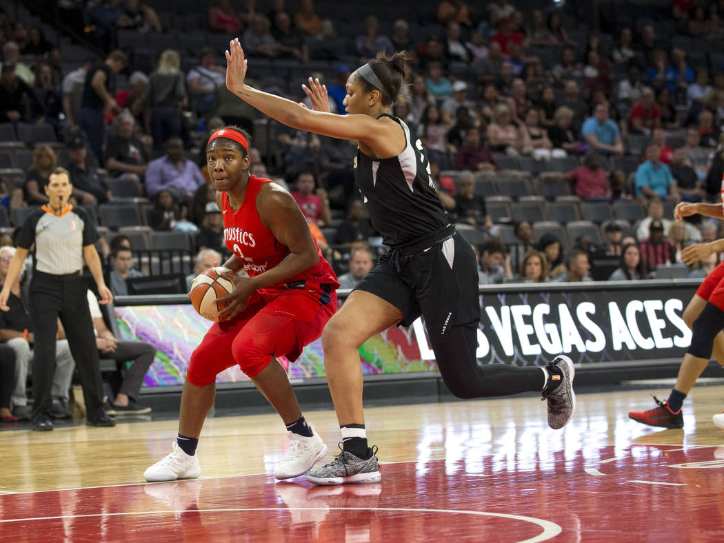 Washington Mystics forward Myisha Hines-Allen (2) looks for a pass through Las Vegas Aces center A'ja Wilson (22) in the first half of a WNBA basketball game at the Mandalay Bay Events Center in L ...