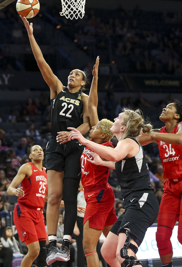 Las Vegas Aces center A'ja Wilson (22) takes a shot over Washington Mystics forward Tianna Hawkins (21) in the second half of a WNBA basketball game at the Mandalay Bay Events Center in Las Vegas ...