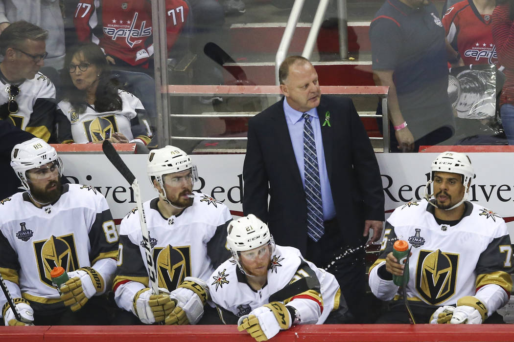 Golden Knights head coach Gerard Gallant, center, looks on during the third period of Game 3 of the NHL hockey Stanley Cup Final against the Washington Capitals at Capital One Arena in Washington ...
